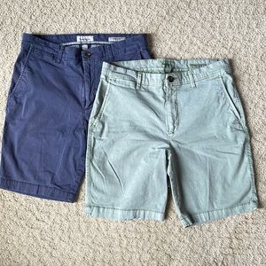 Two pair of navy and green men’s shorts by Goodiellow